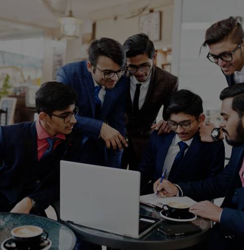 collaborative-process-indian-business-mans-brainstorming-meeting-officediverse-team-young-people-dressed-suits-cooperating-developing-common-project