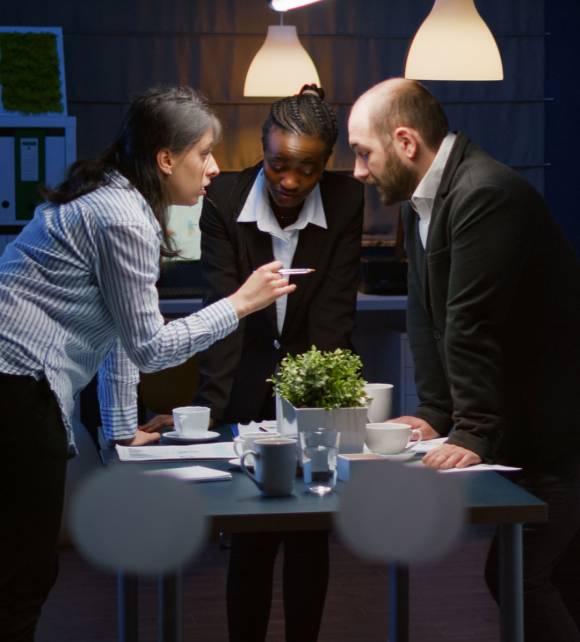 focused-leader-woman-enter-office-meeting-room-lean-conference-table-brainstorming-business-company-presentation-late-night-diverse-multi-ethnic-teamwork-solving-management-strategy